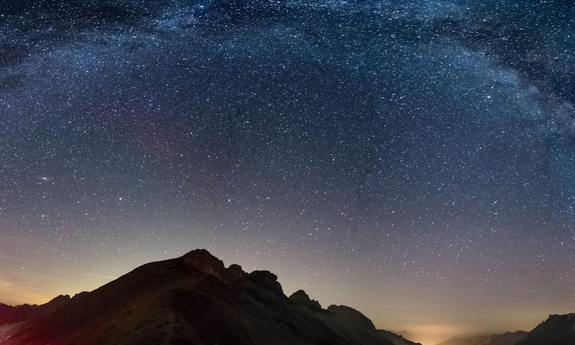 Backdrop website photo of universe and mountains for code the earth